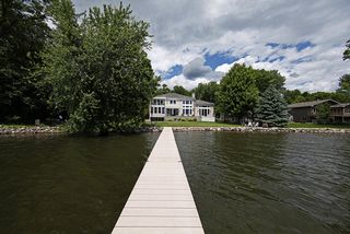 Bald Eagle Lake, sandy beach area with fieldstone protected shoreline