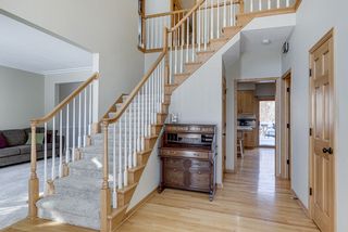 Central grand staircase - front entry closet