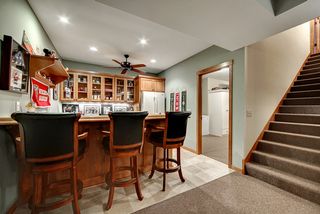 Full bar area off of the Theatre space, bar sink, refrigerator and work area.