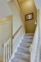 Stairs with landing to upper level