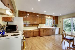 Notice the updated flooring, newer windows, and updated lighting in the open kitchen