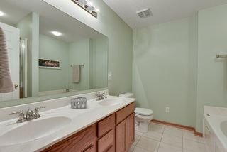 Master bath with double sinks, inviting whirlpool tub, and separate shower...