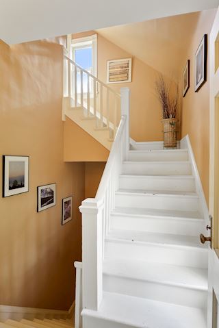 This staircase leads to the unfinished third floor attic offering great storage and possible additional finished space