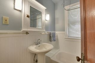 The Charming Bathroom features a Pedestal Sink and Extra Deep Bathtub/Shower