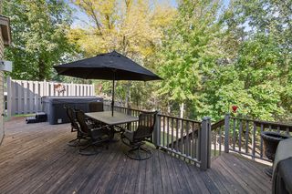 Deck over looking a wooded back yard.