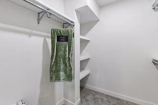 First your new walk-in closet with custom built-ins and a bounty of rods and shelves