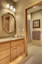 Lower level full bath with double granite vanities and separate tub/ shower area