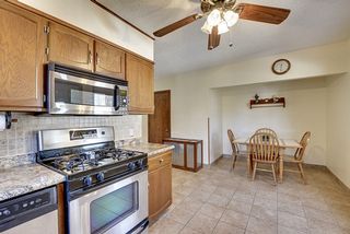 Gas range with overhead microwave oven. 