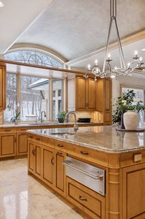 Island with Vegetable sink and Warming Drawer.