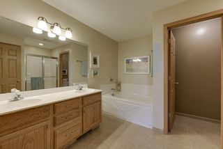 Spacious upper level bath with double sinks and separate tub and shower...