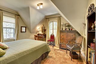Bedroom #2 is SO CHARMING! You will find the Original Arched Window & Hardwood Floors.