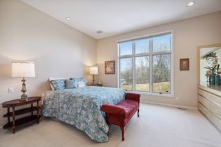 Primary bedroom with large built-in dresser and armoire.