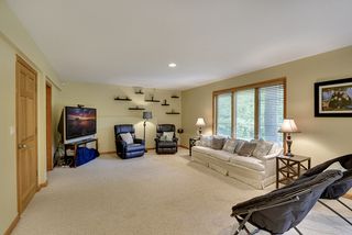 Lower level family room with large windows and wonderful backyard views