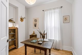 Main level office is sunlit and pleasant