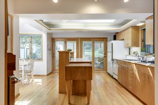 Additional kitchen square footage and fabulous screen porch were added 
