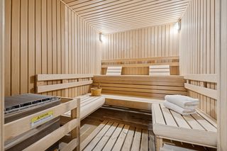Sauna is located across the hall from the Exercise Room in a Beautiful 3/4 bath that also includes a Steam Shower.