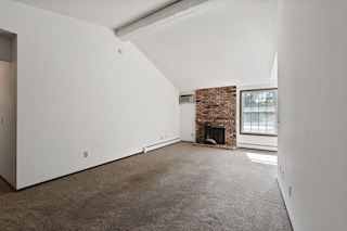 Large Living Room with fireplace and south facing windows 