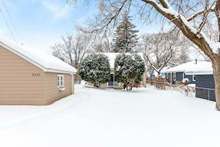 View of back of house - yard is fenced in on three sides