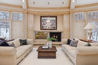 Television, fireplace and artwork are all beautiful focal points.