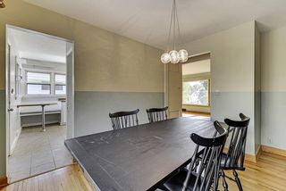 Nice traffic flow! The Dining Room features Hardwood Floors & Pendant Glass Light Fixture! 