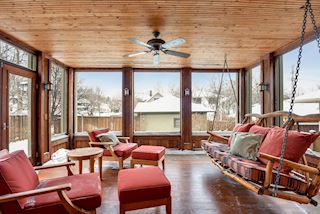 Main floor screen porch off the kitchen. Swing will stay with property.