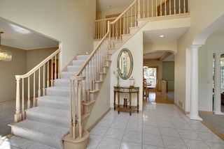 Open Staircase to the large 2 story Foyer area. Walk - through to Kitchen / Kitchen/Eating area.