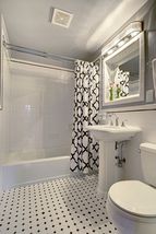 The 2nd Floor Bathroom features High-End Tile, Lighting & Pedestal Sink...