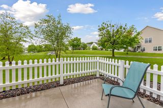 Green space and a view of walking path through neighborhood.