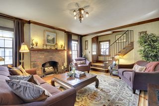 The "Magical" interior features Original Light Fixtures & Rich Natural Woodwork...