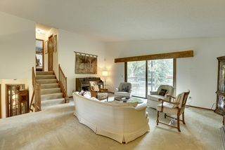 Large, bright living area with a beautiful view of the private yard and toward Lake Windsor.