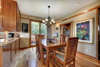 Formal Dining area defined by the craftsmen style banding and flanked by the glass display uppers.