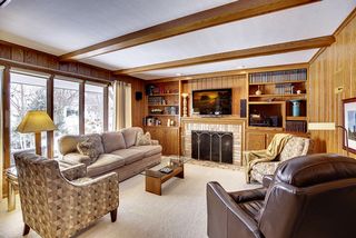 Main floor living room with builtins and fireplace
