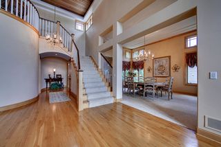 Grand staircase leading to 2nd level, cherry rail and painted stair parts. Curved, softened corners throughout.