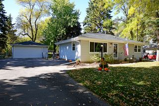 Newer driveway leads to spacious two-car garage