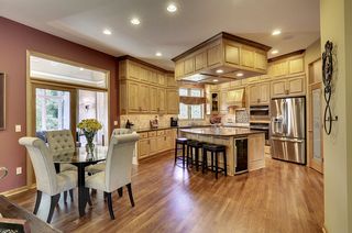 Spacious kitchen with all new appliances, including a beverage fridge in the center island