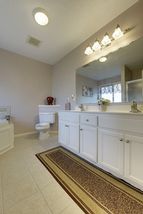 Private master bath with double vanity, standing shower and jetted tub