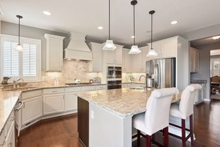 Oversized kitchen island w/ Quartz countertops & prep sink