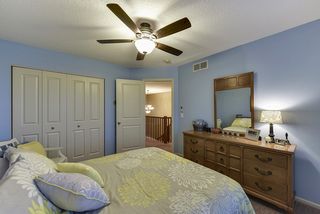 Bedroom 2 with ceiling fan on the upper level