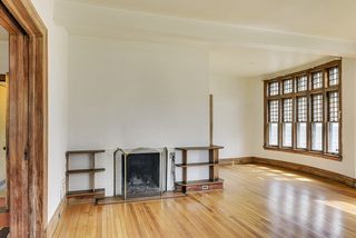 The Living Room also features this Wood Burning Fireplace! 