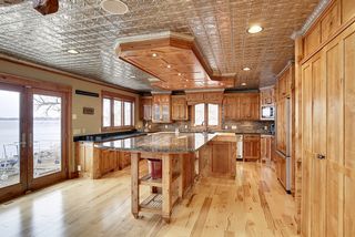 A tin ceiling system gives a warm feel complimented by the use of wood and granite work surfaces.