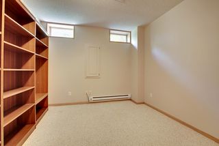 Lower Den/Office area - bookcases and high windows flank this space.