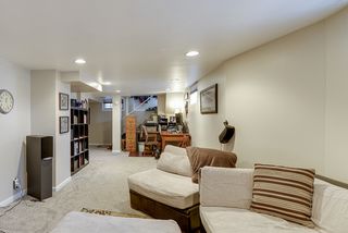 family room lower level with newer carpeting, recessed lighting