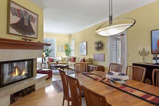 ...leading from the Living Room to the Dining Room and Family Room anchored by the two sided wood burning fireplace