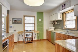 The fabulous custom designed Kitchen features Cork Flooring, Granite Countertops & Stainless Steel Appliances! 