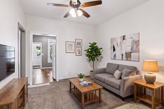 Virtually staged lower unit living room