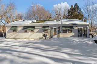 Large backyard deck with built-in seating- the perfect spot for entertaining in the summer months.