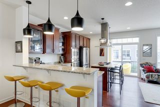 Big breakfast bar with attractive pendant lighting.