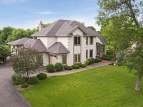 Stately two story with a convenient side load 3 car garage