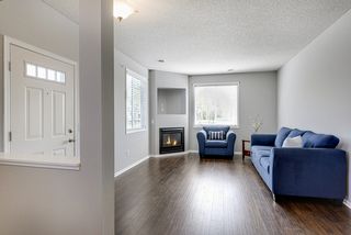 Relax in inviting living room with cozy fireplace...