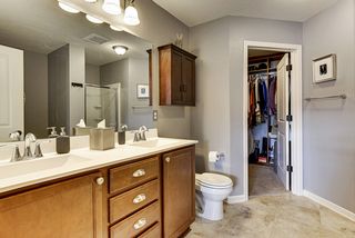 Master Bath with Double Sink Vanity, Maple Cabinetry and Tile